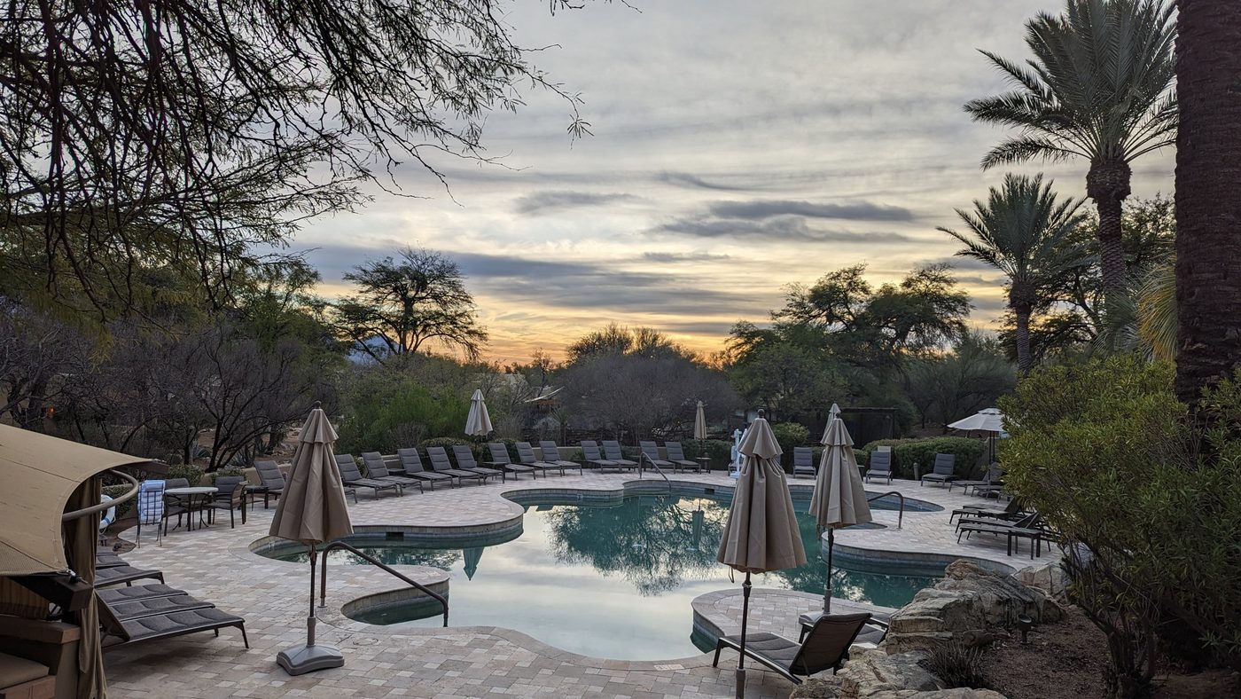 A quiet resort pool at dusk in the Sonoran Desert outside Tucson