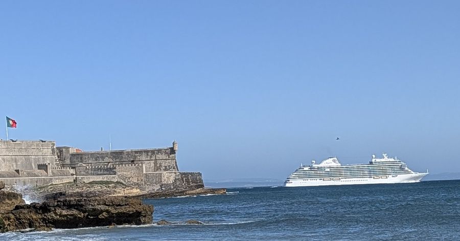 A seaside fort and a cruise ship on the Portuguese coast